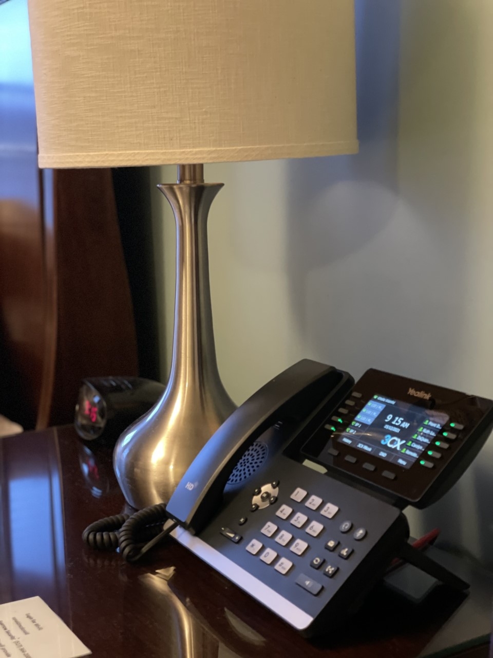 Night stand with a phone and lamp