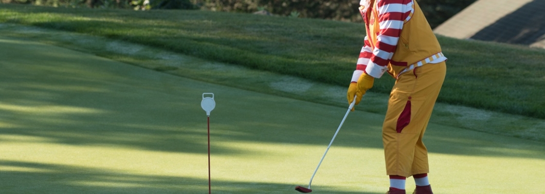 Ronald McDonald golfing